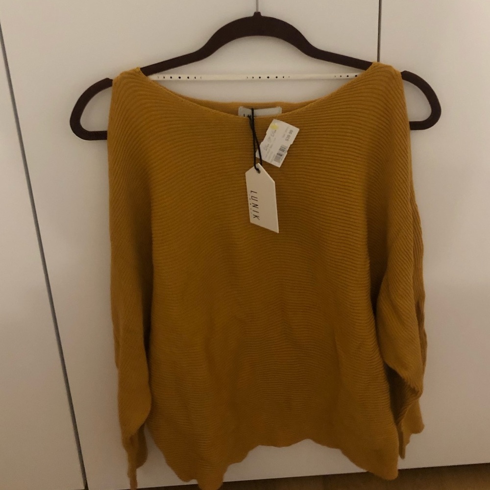 Open shoulder sweater